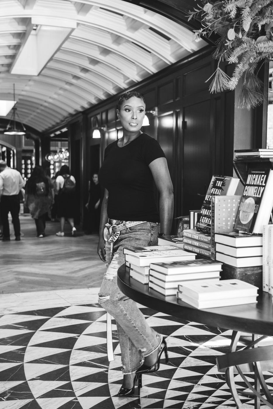 Branding portrait in a bookstore hallway