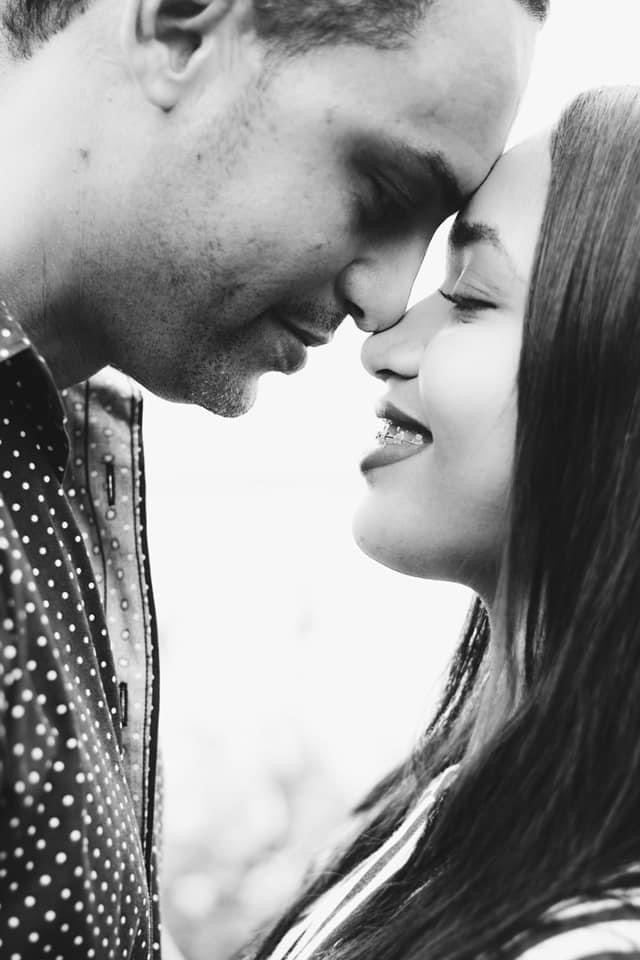 Black and white couple portrait, foreheads touching