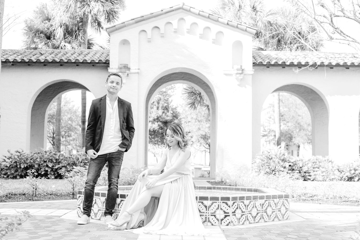 Engaged couple by a tiled fountain