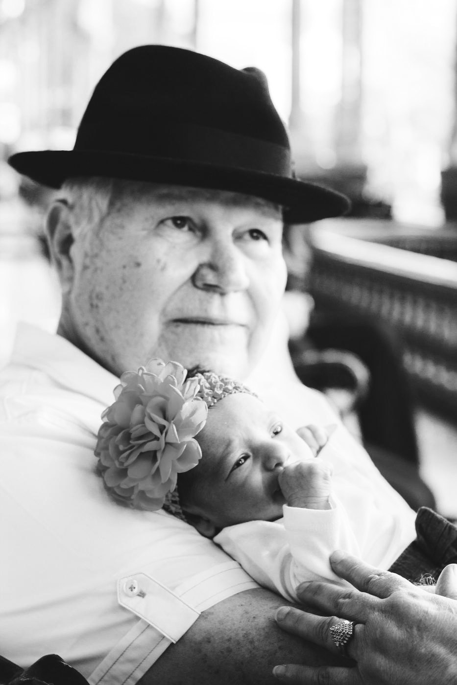 Grandfather holding his newborn granddaughter