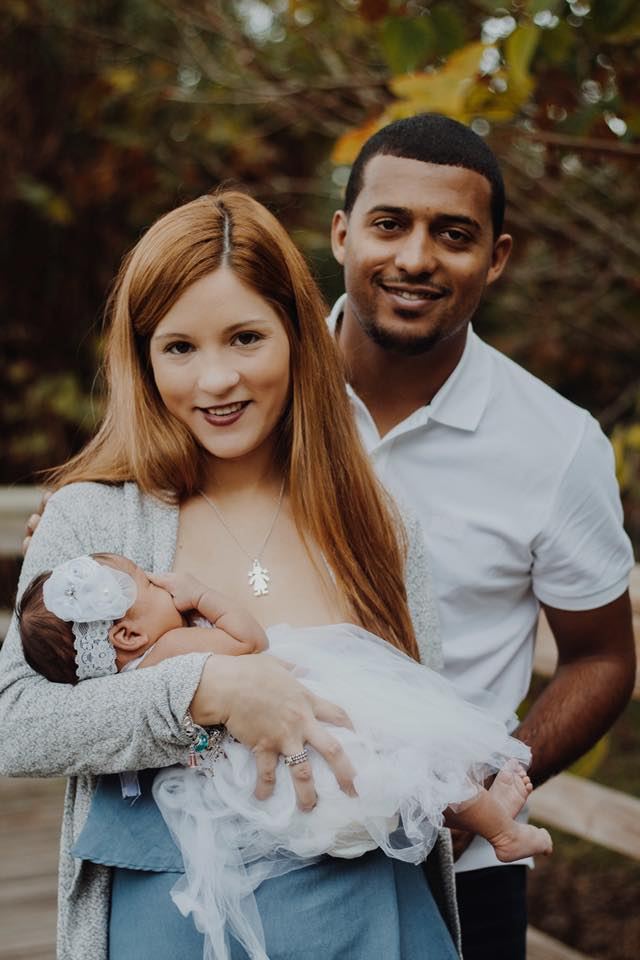 Parents holding their newborn