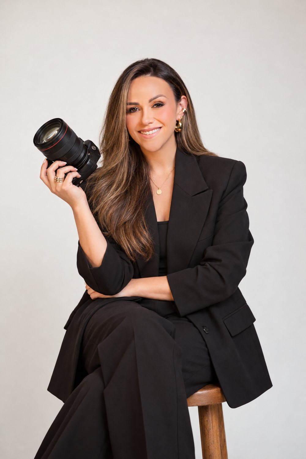 Stephanie Ortiz, founder of Align, holding a camera