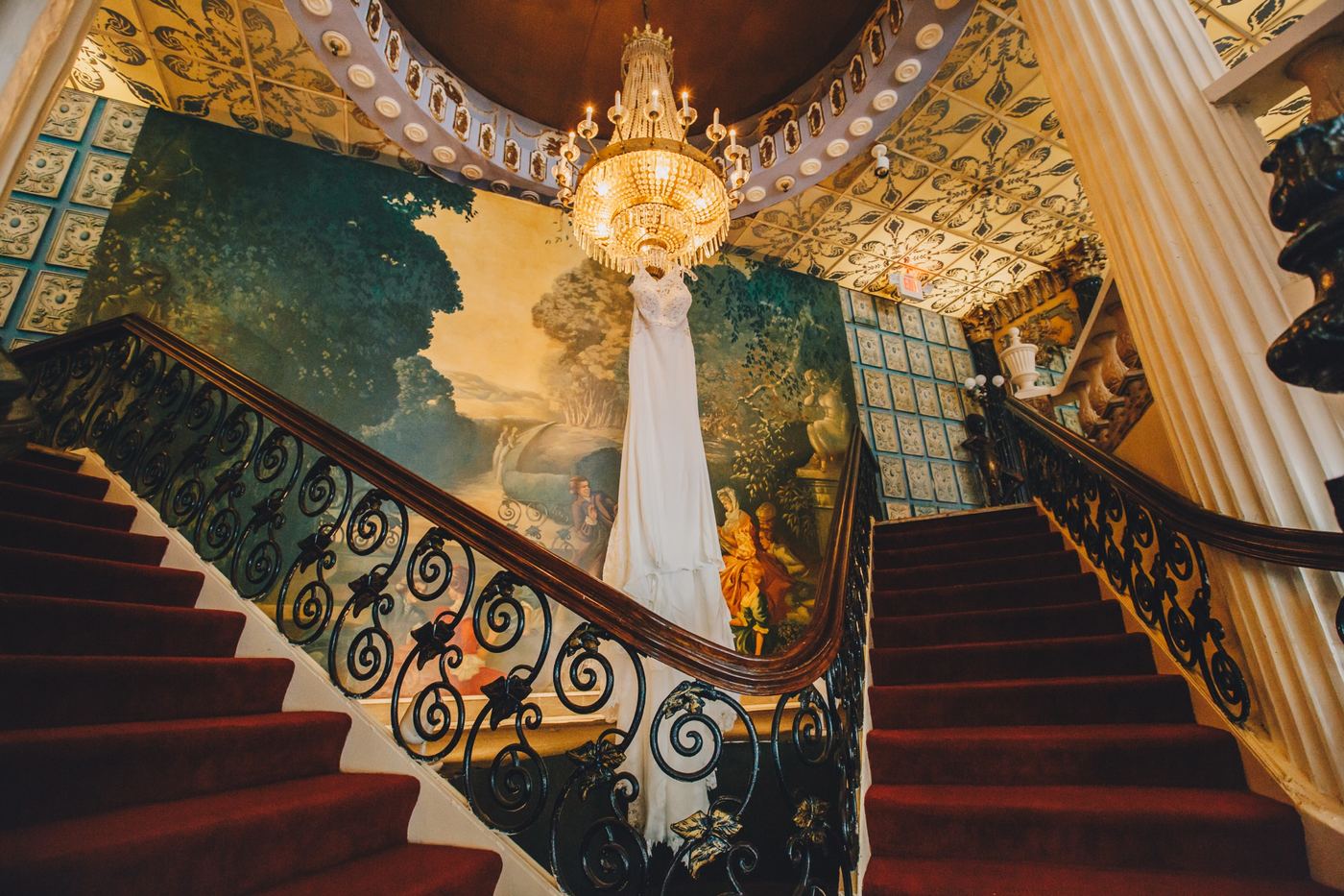 Wedding dress hanging over the staircase