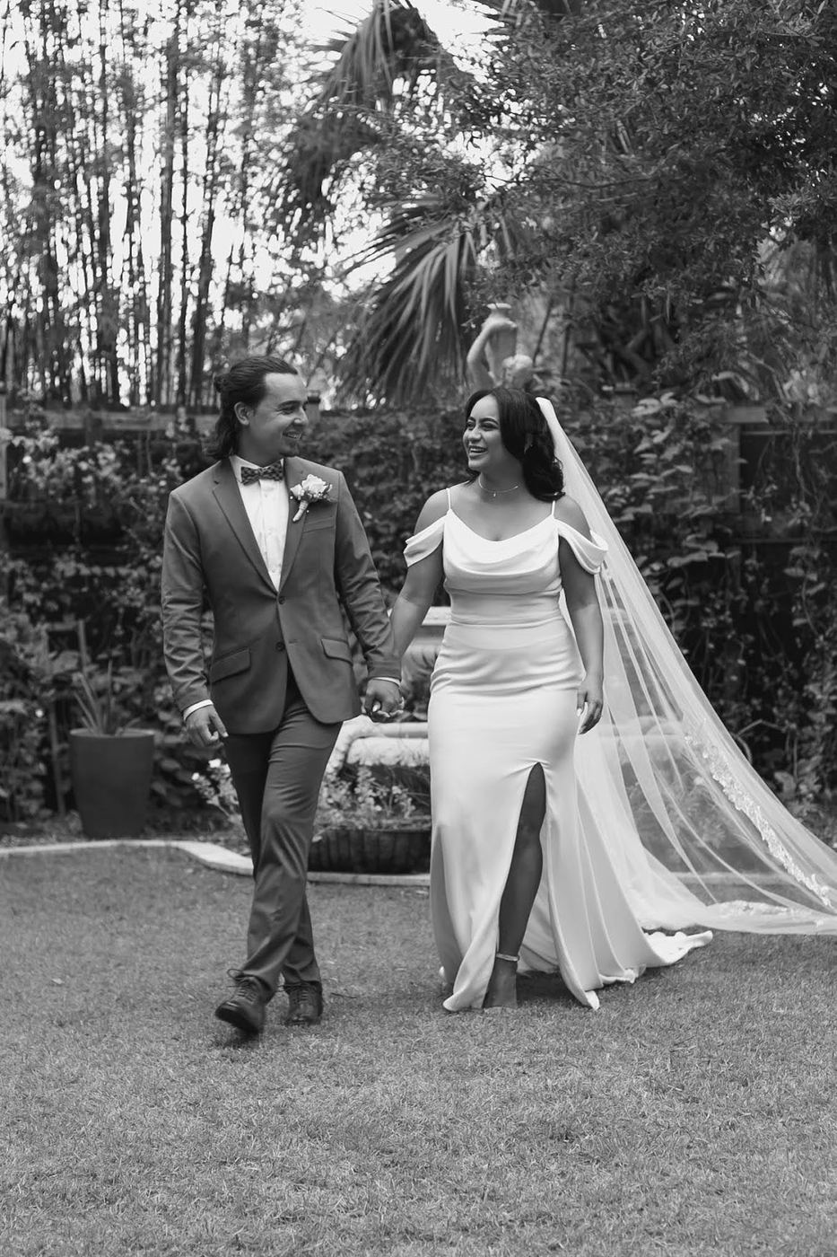 Newlyweds walking through the garden