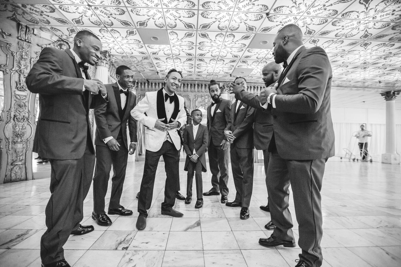 Groom and groomsmen in the ballroom